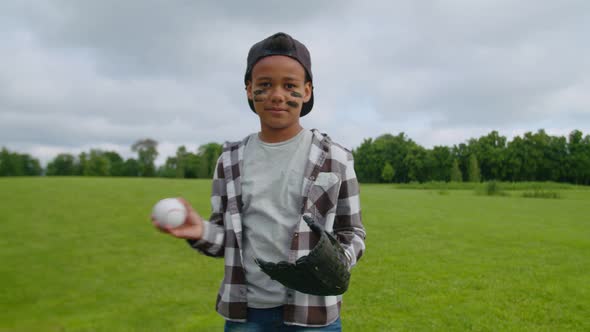 Concentrated Preadolescent Boy Baseball Player Ready for Pitch in Field alt