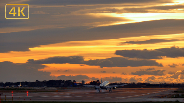Commercial Aircraft Landing at Barcelona Airport at Sunset alt