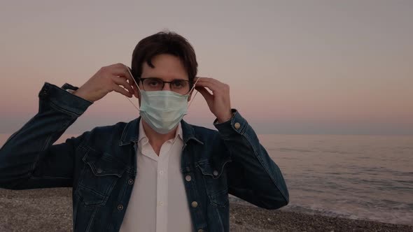 Boy is Putting the Mask on the Beach alt