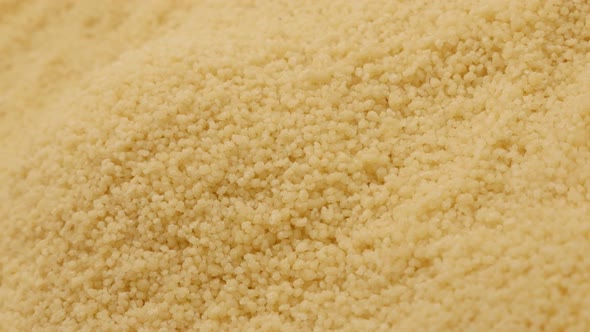 Couscous balls falling over pile of traditional nord African food background 4K 2160p 30fps UltraHD  alt