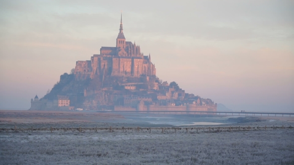 The Island of Mont-Saint-Michel at Dawn alt