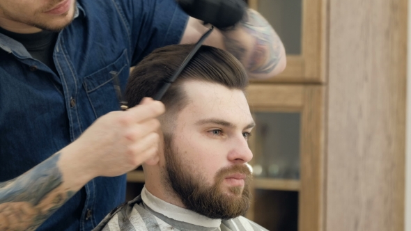 VideoHive Portrait of Attractive Young Man Getting Trendy Haircut Male Hairdresser Serving Client 19618372 VideoHive Portrait of Attractive Young Man Getting Trendy Haircut Male Hairdresser Serving Client 19618372