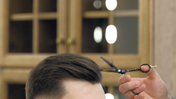 VideoHive Master Cuts Hair and Beard in the Barber Shop Black Gloves with Tattoos Off of Hands 19618445 VideoHive Master Cuts Hair and Beard in the Barber Shop Black Gloves with Tattoos Off of Hands 19618445
