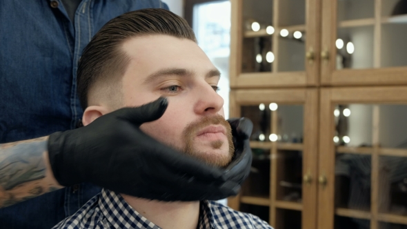 VideoHive Handsome Bearded Man While Getting Haircut By Hairdresser at the Barbershop 19620147 VideoHive Handsome Bearded Man While Getting Haircut By Hairdresser at the Barbershop 19620147
