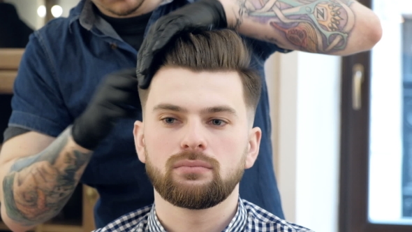 VideoHive Male Barber in Plaid Shirt Combing Hair of a Male Client at Barbershop 19620420 VideoHive Male Barber in Plaid Shirt Combing Hair of a Male Client at Barbershop 19620420