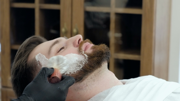 VideoHive Client During Beard Shaving in Barber Shop 19620434 VideoHive Client During Beard Shaving in Barber Shop 19620434