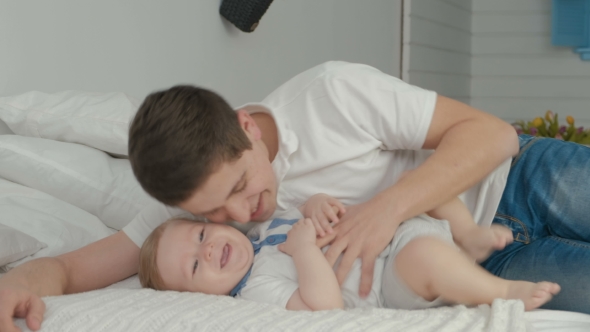 VideoHive Young Father Is Having Fun with His Little Baby 19622243 VideoHive Young Father Is Having Fun with His Little Baby 19622243