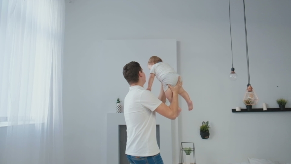 VideoHive Young Father Playing with His Little Baby 19622297 VideoHive Young Father Playing with His Little Baby 19622297