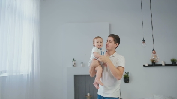 VideoHive Young Father Playing with His Little Baby 19622346 VideoHive Young Father Playing with His Little Baby 19622346