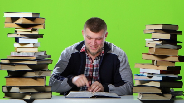 Guy Suddenly Finds His Article in the Book and Is Very Happy. Green Screen alt