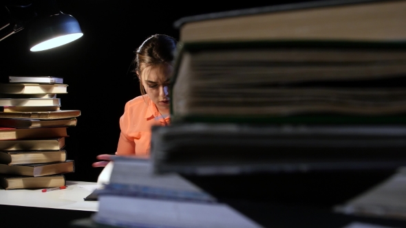 Girl Goes Through a Lot of Books and Can Not Find the Desired Information. Black Background alt