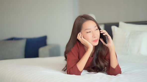 Young asian woman use smart phone