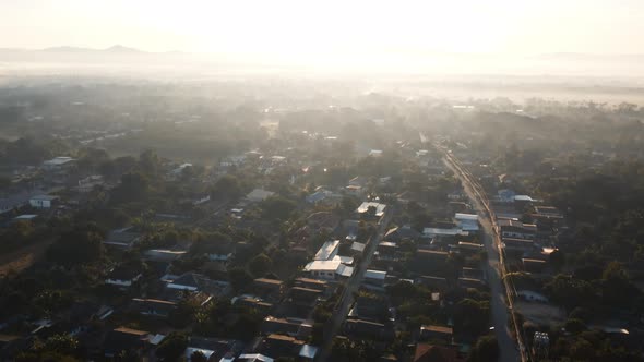 Establishing Aerial View Shot above asia village in morning