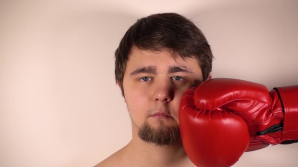 Punch Red Boxing Glove in Face Man