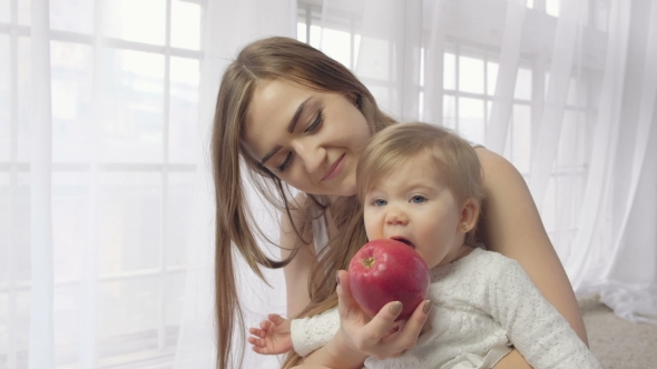 VideoHive Mother Holding Baby with Apple 19637076 VideoHive Mother Holding Baby with Apple 19637076