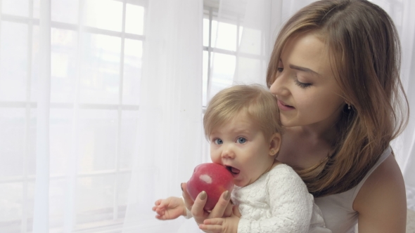 VideoHive Mother Holding Baby with Apple 19637545 VideoHive Mother Holding Baby with Apple 19637545