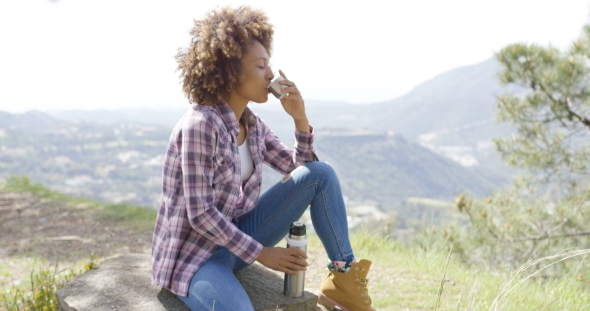 Side View of Tourist Drinking on Rest alt