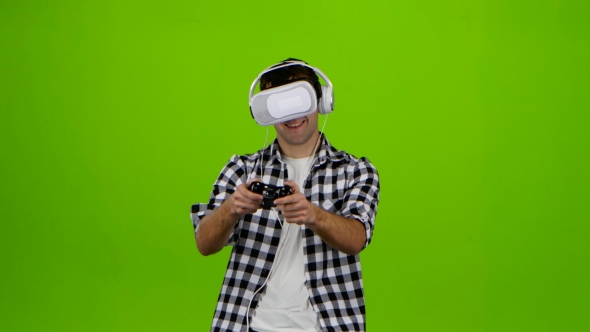 Man Plays on Gamepad with Headphones and Vr Glasses. Studio alt