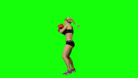 Boxer Standing in the Front and Make Swings and Kicks. Green Screen. Side View alt