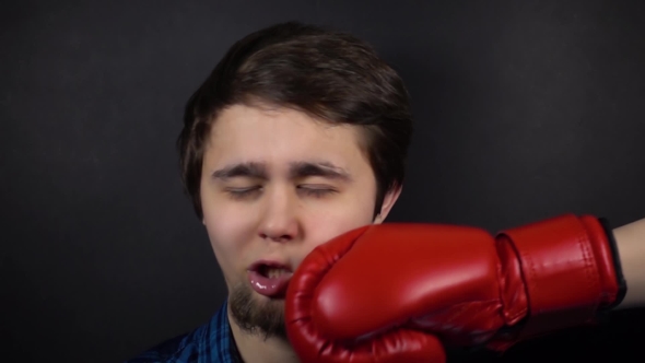 Punch Red Boxing Glove in Face Man