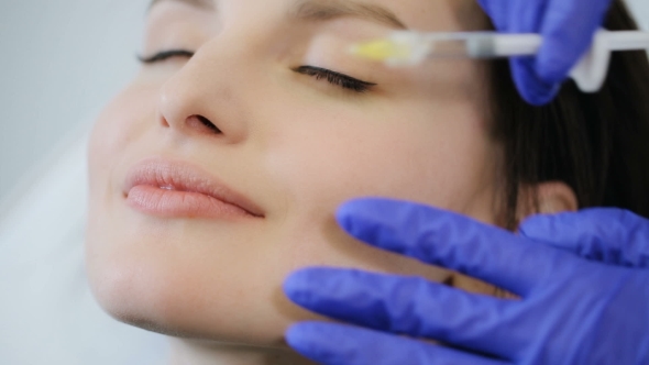 Woman Receive Botox Injection in Lips alt