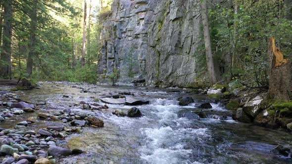 Rapids Over Smooth Mossy Rocks On River Creek In Forest. Low Aerial alt