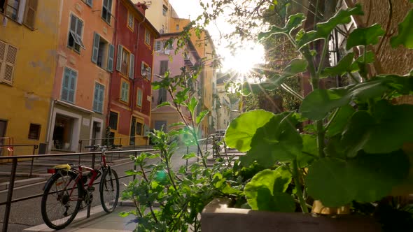 Street of Nice, France. Sun Rays Are Illuminating the Street. Old Pastel Colored Houses Are Located alt