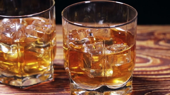 Glasses of Malt Whiskey on a Black Table