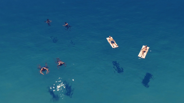 People Swimming in The Sea alt