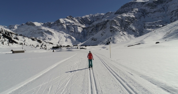 Woman Cross Country Skiing on Groomed-trail