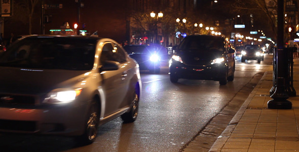Cars Driving Down City Street At Night 4