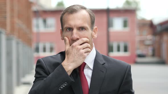 Shocked Businessman Wondering in Awe alt