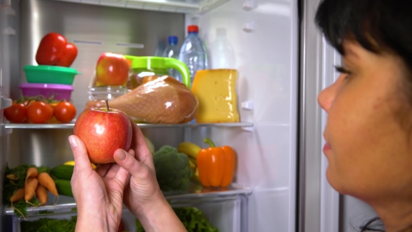 Woman Picks an Apple or Meat