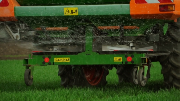 The Tractor Introduces Mineral Fertilizers into the Soil alt