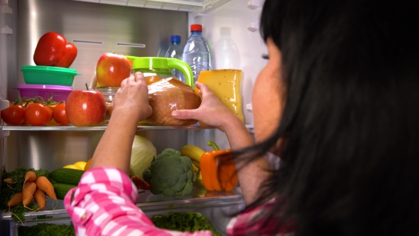 Woman Picks an Apple or Meat