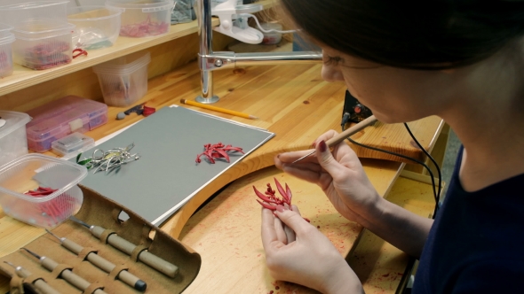 Woman Works On Wax Model Of Jewelry In Jewelery Workshop