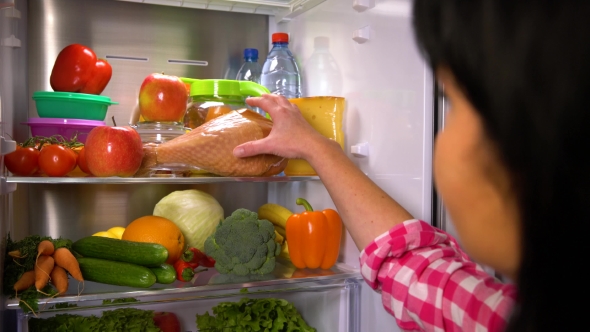 Woman Picks an Apple or Meat