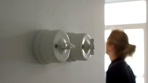 A Woman Hand Turning on and Off a Light Switch in a House, Stock Footage