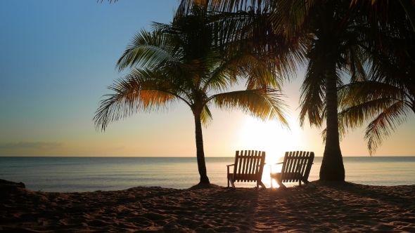 Two Chairs Placed in the Sand alt