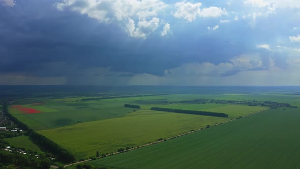 Aerial View Of The Thundercloud Above The Field alt