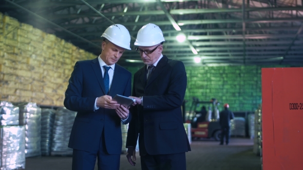 The Specialists Talking in Warehouse alt