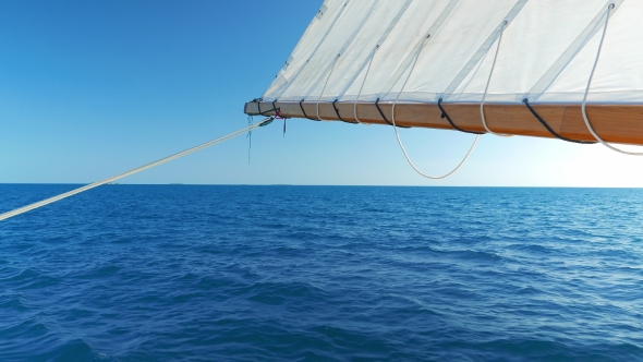 Sail Being Hold By the Back of the Boat