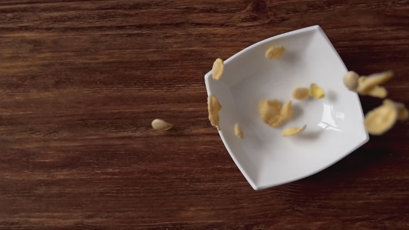 Corn Flakes Falling in White Bowl  alt