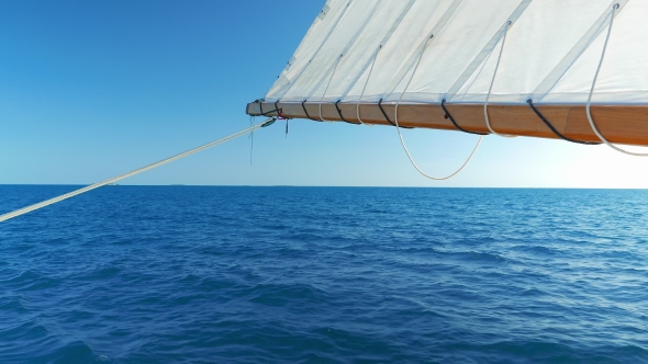 Sail Being Hold By the Back of the Boat