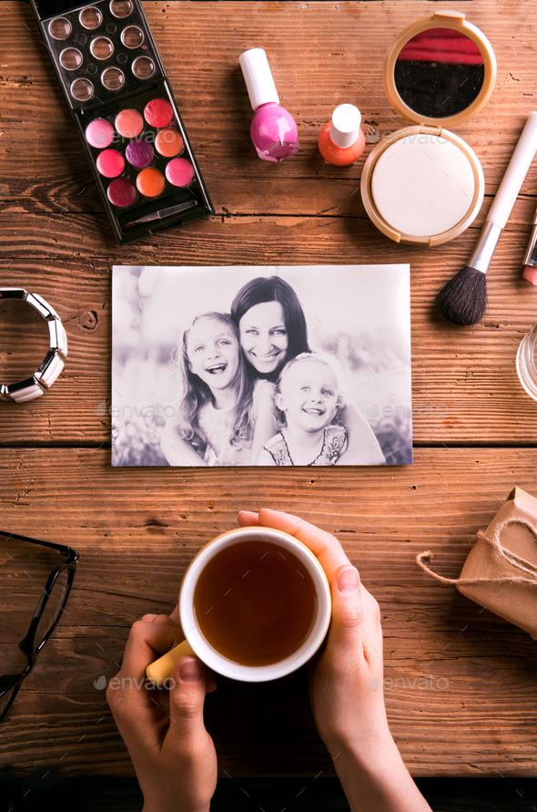 Mothers day composition. Photo, coffee and make up products