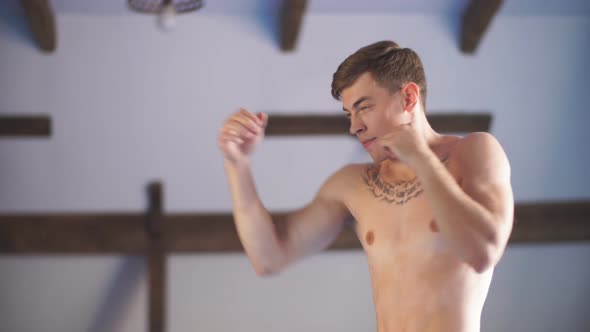 Man Training Karate in Gym alt