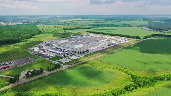 Industry surrounded by green nature alt