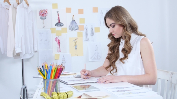 Designer in His Workshop Creates Masterpieces for the New Women's Collection alt