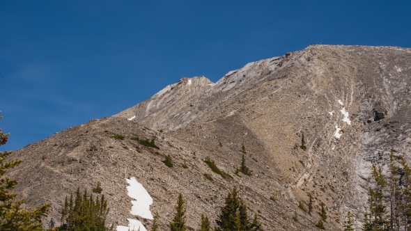 Hikers Summiting the Last Pitch of Mountain alt