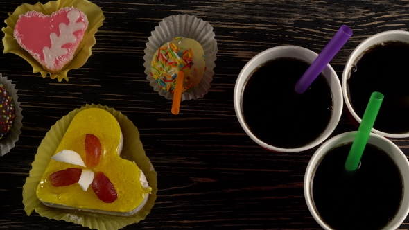 Delicious Cupcakes with Drinks.